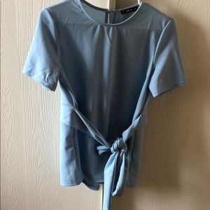 Blue blouse with tie